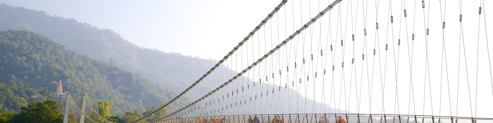 Ram Jhula showing a river or creek and a suspension bridge or treetop walkway