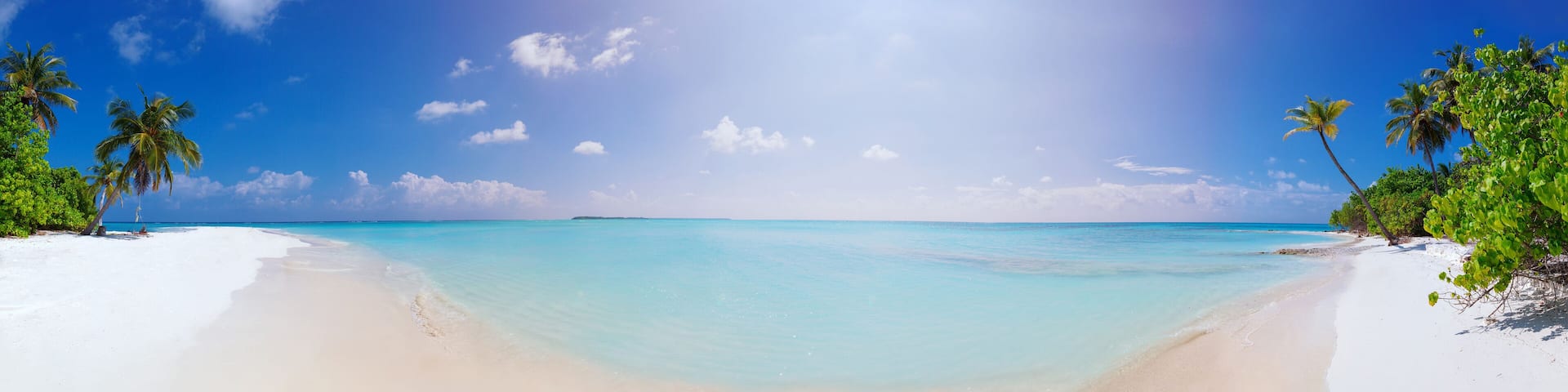 Panorama of Beach at Maldives island Fulhadhoo with white sandy idyllic perfect beach and sea and curve palm