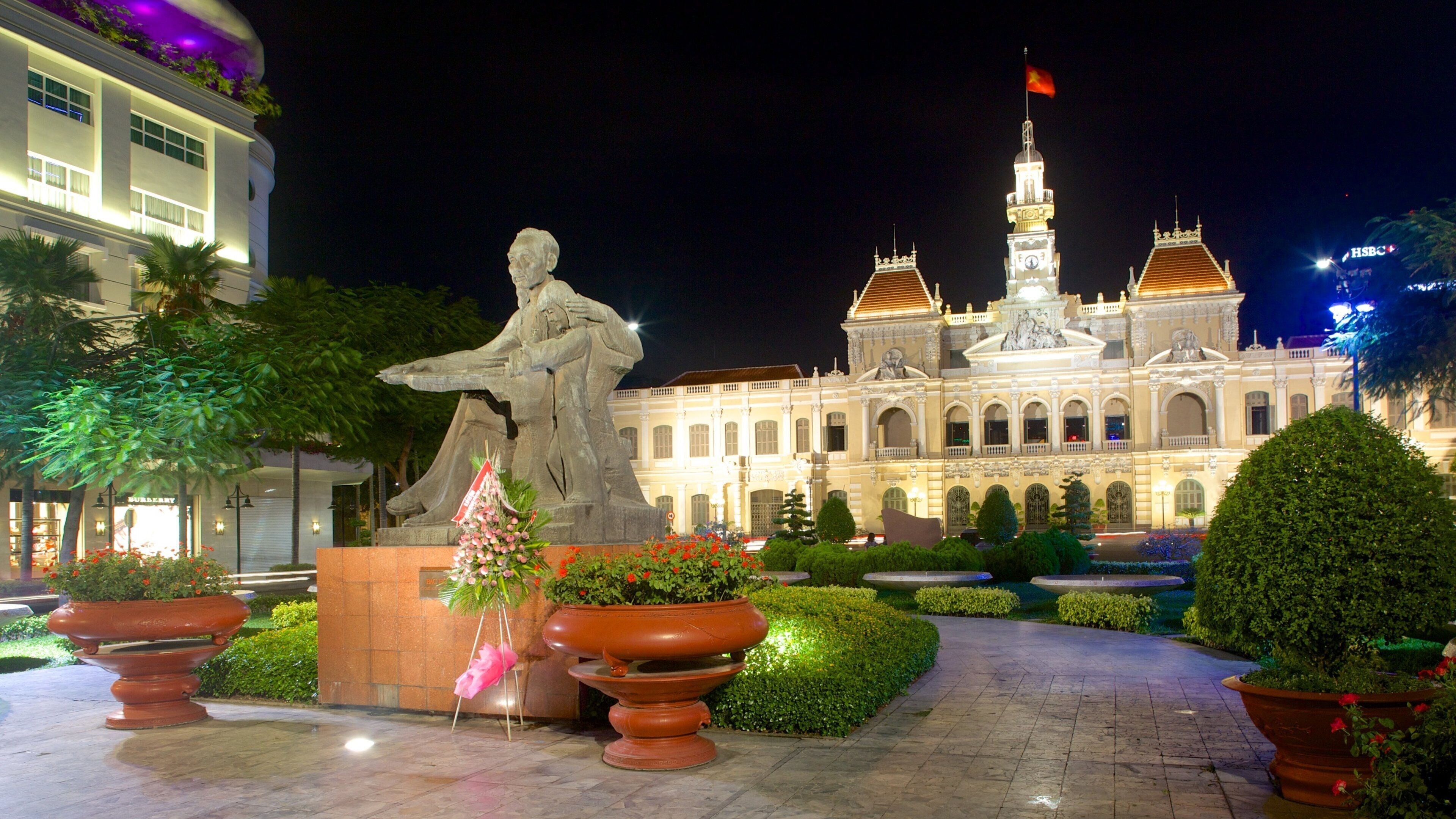Dong Khoi Street which includes night scenes, a park and a statue or sculpture
