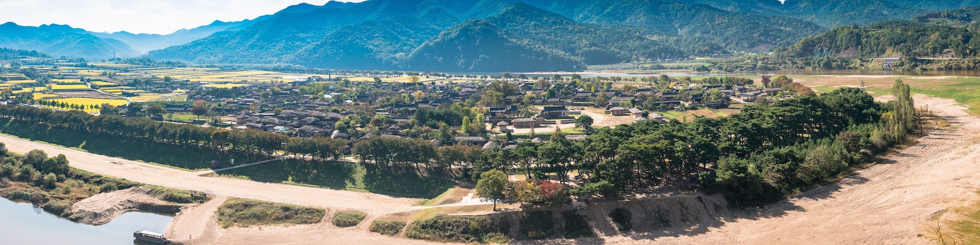A mountainous landscape with a village nestled among the hills.