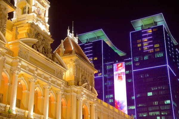Ho Chi Minh City Hall Square showing night scenes, modern architecture and heritage architecture