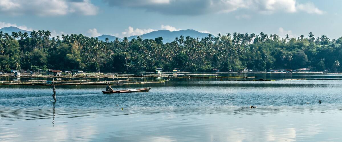 one of the seven lakes in San Pablo , Laguna, Philippines during summer season. Known as the land of the seven lakes formed by volcanic activity. its being used as a fishing farm by the locals.