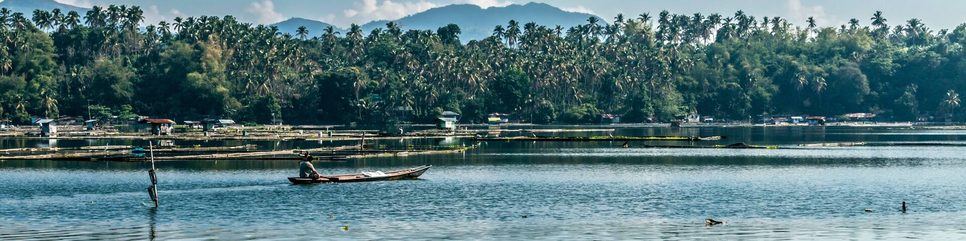 one of the seven lakes in San Pablo , Laguna, Philippines during summer season. Known as the land of the seven lakes formed by volcanic activity. its being used as a fishing farm by the locals.
