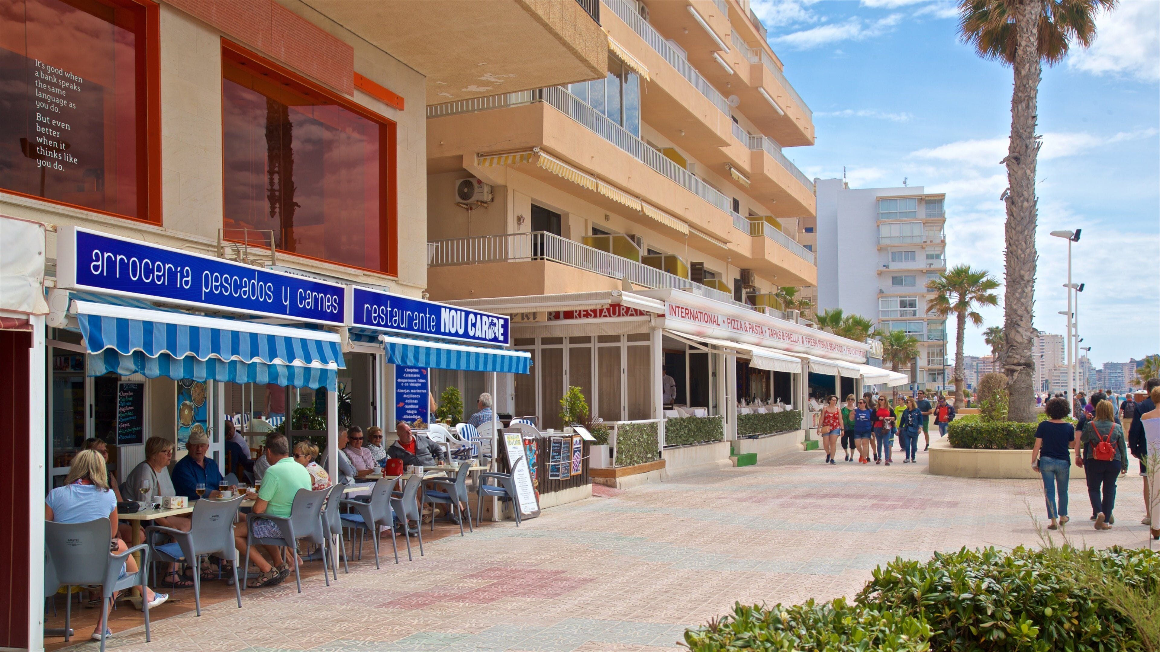 Arenal-Bol Beach showing outdoor eating, cafe lifestyle and a coastal town