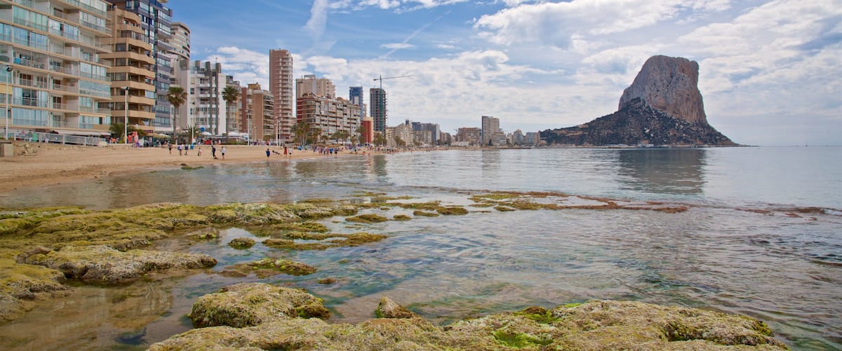 Arenal-Bol Beach which includes rocky coastline and general coastal views
