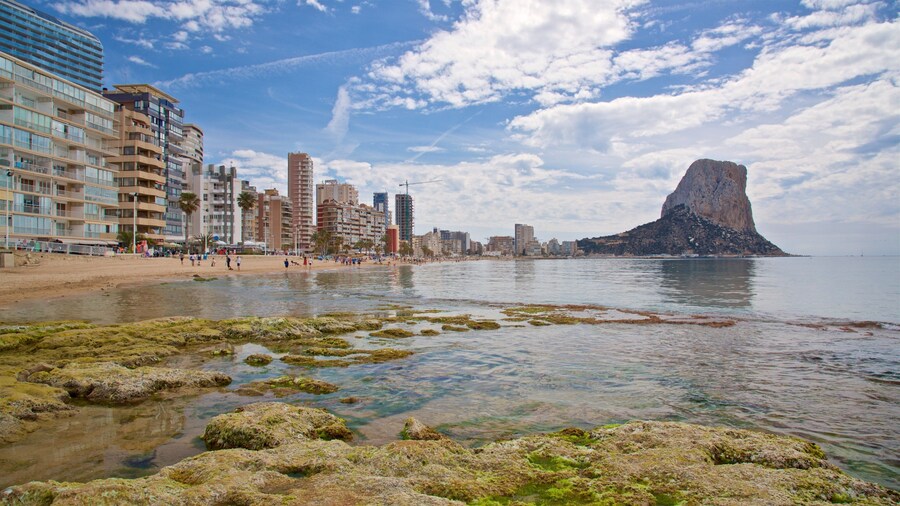 Arenal-Bol Beach which includes rocky coastline and general coastal views