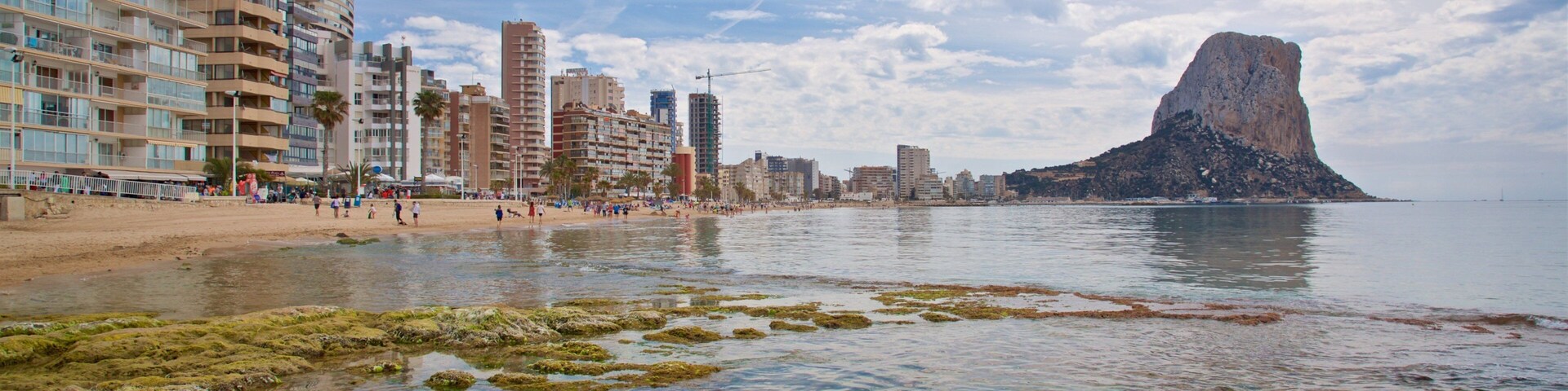 Arenal-Bol Beach which includes rocky coastline and general coastal views
