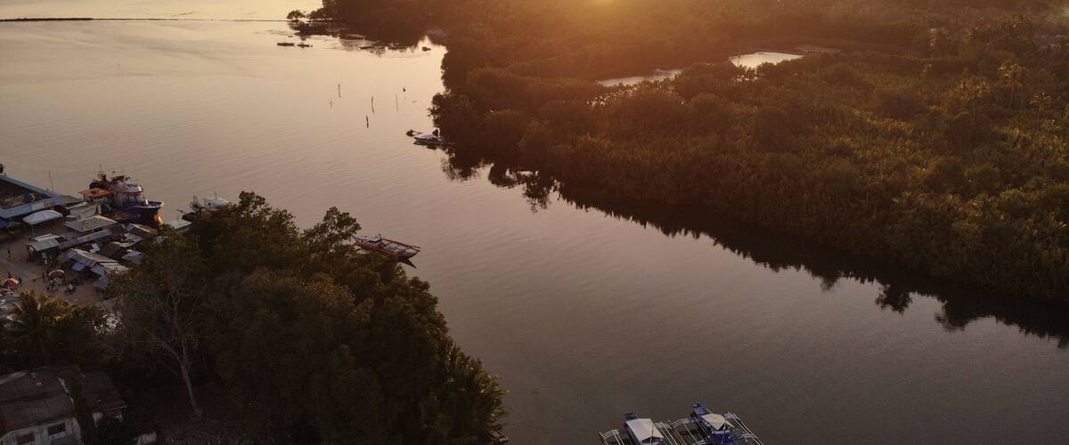 Drone shot during sunset near the restaurant; this is where Loboc river flows into the sea