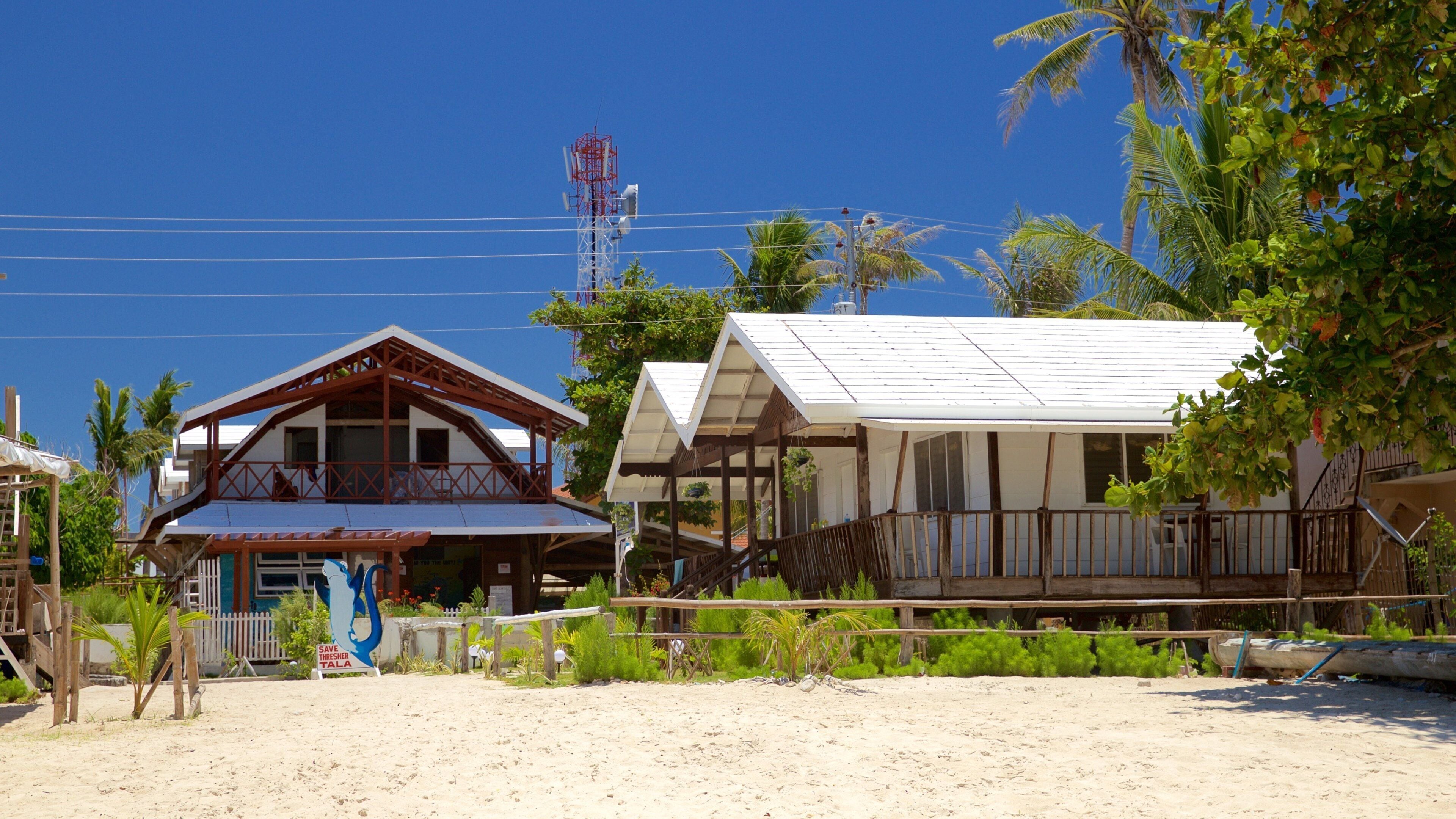 Logon showing a house and a sandy beach