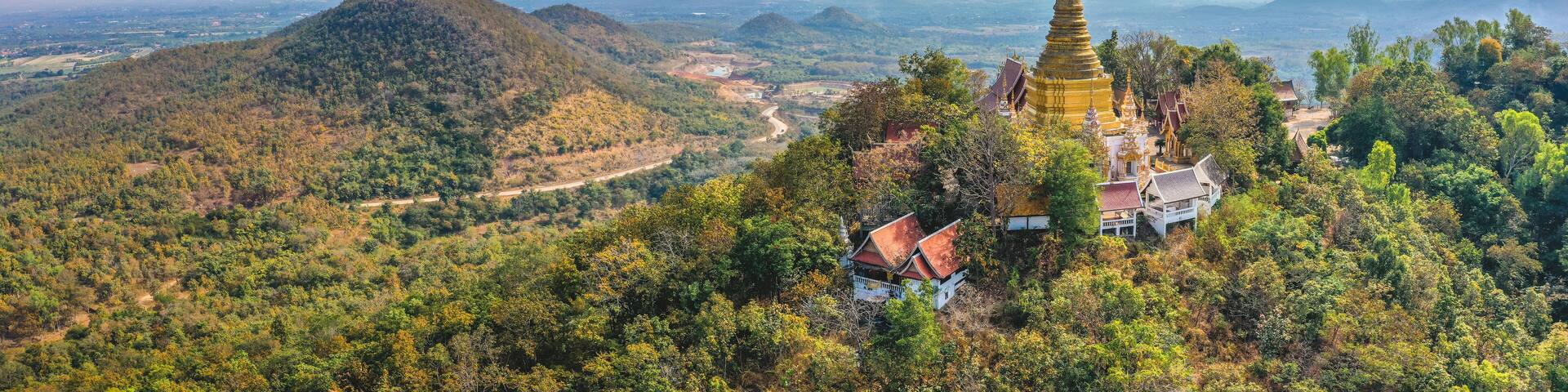 Aerial view of Wat Phra Phutthabat Tak Pha temple on top of the mountain in Lamphun, Thailand