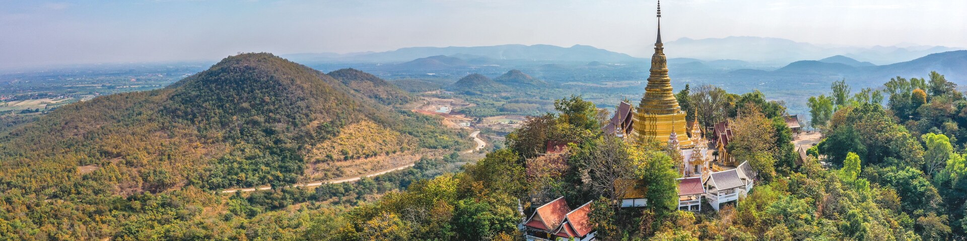 Aerial view of Wat Phra Phutthabat Tak Pha temple on top of the mountain in Lamphun, Thailand