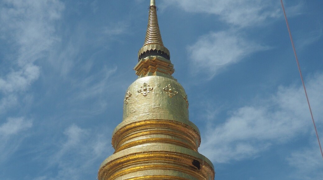Wat Phra That Hariphunchai (Thai: วัดพระธาตุหริภุญชัย) is a Buddhist temple (wat) in Lamphun, Thailand. The temple's origins date from the 11th century but the central stupa is thought to originate in the 9th century. Every year in September, there is a huge festival with "donation trees", colourful handmade ornaments resembling trees, in which people give their offerings to the temple, the monks and the spirits.