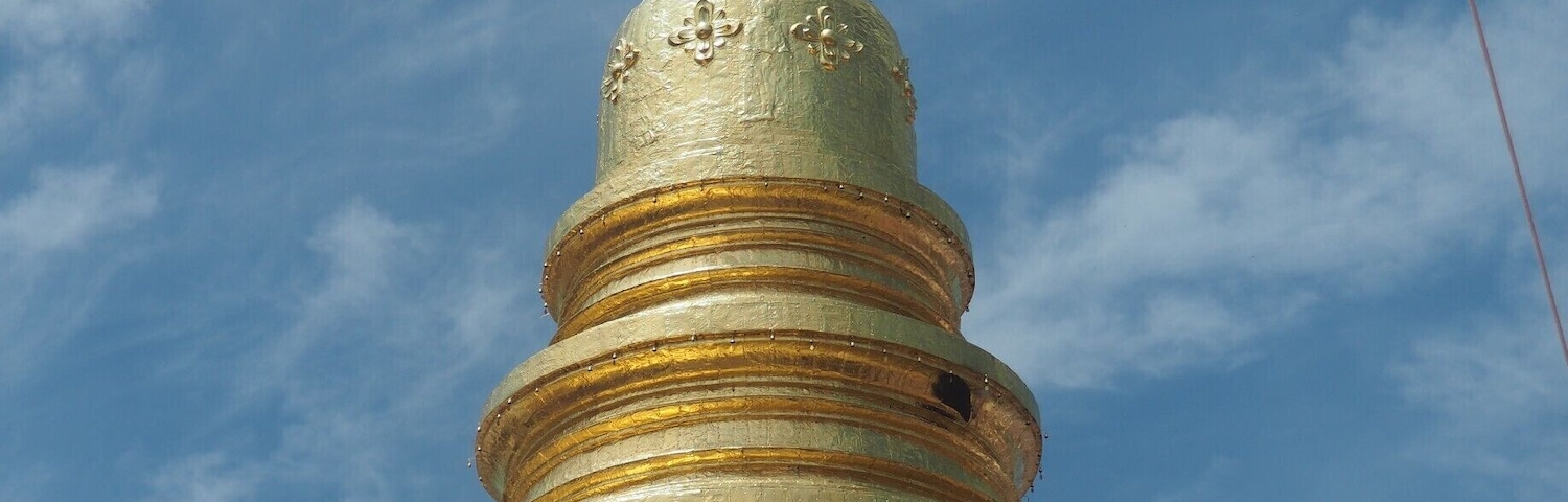 Wat Phra That Hariphunchai (Thai: วัดพระธาตุหริภุญชัย) is a Buddhist temple (wat) in Lamphun, Thailand. The temple's origins date from the 11th century but the central stupa is thought to originate in the 9th century. Every year in September, there is a huge festival with "donation trees", colourful handmade ornaments resembling trees, in which people give their offerings to the temple, the monks and the spirits.