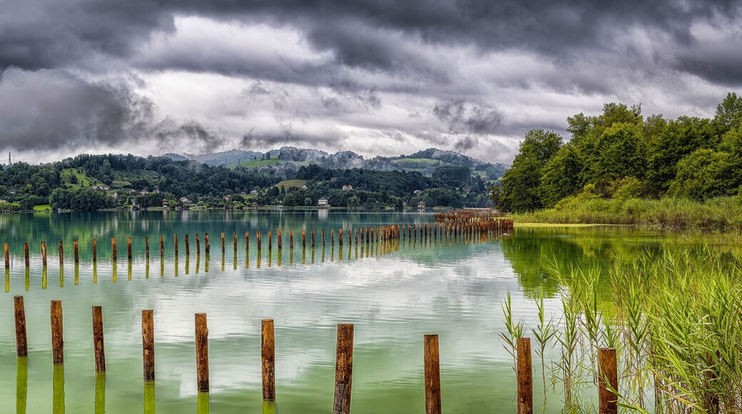 Lake Aiguebelette with reflections under stormy sky