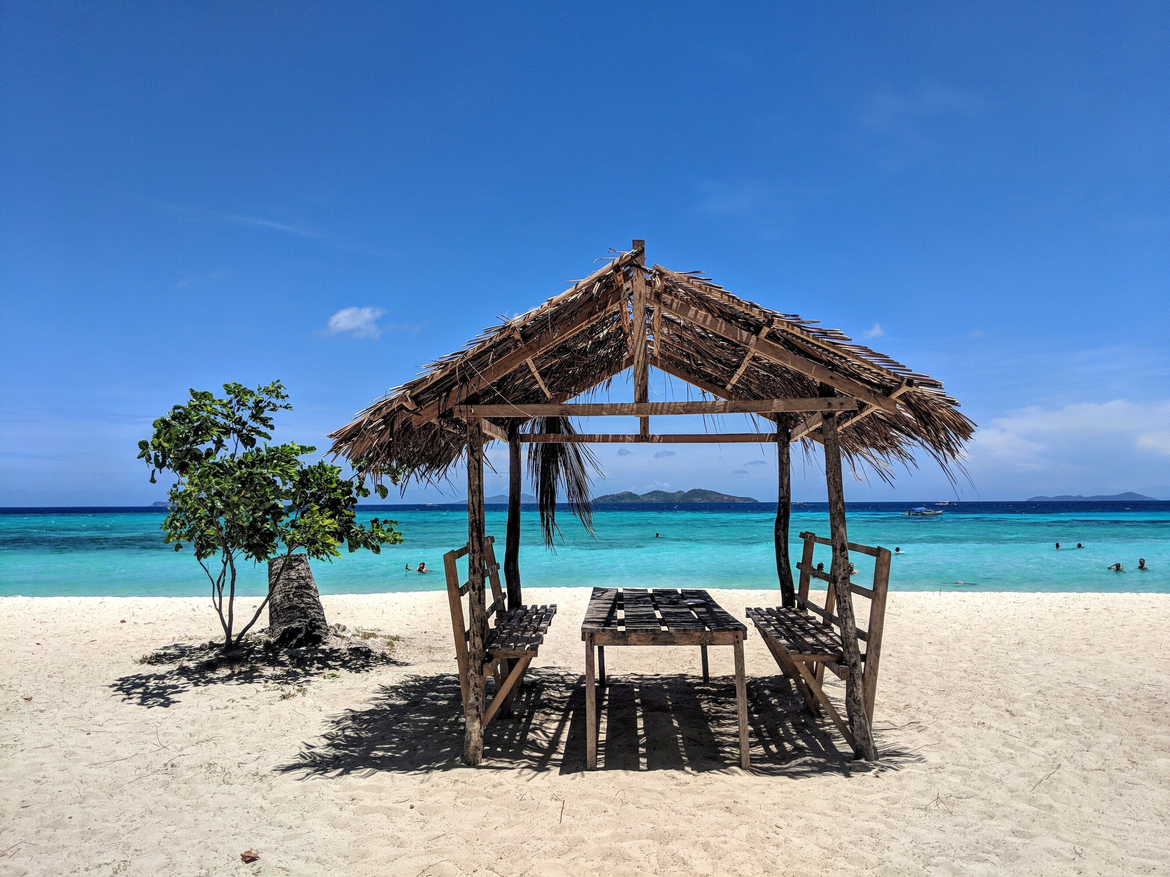 Malcapuya island in Coron, Philippines. Island hopping tours are convenient, they can easily get packed and rushed. If you are looking to relax and soak in some of these beautiful beaches, then rent a private boat for specific islands for a couple of hours. #BeachTips #palawan #coron #philippines #beach #island #malcapuya 