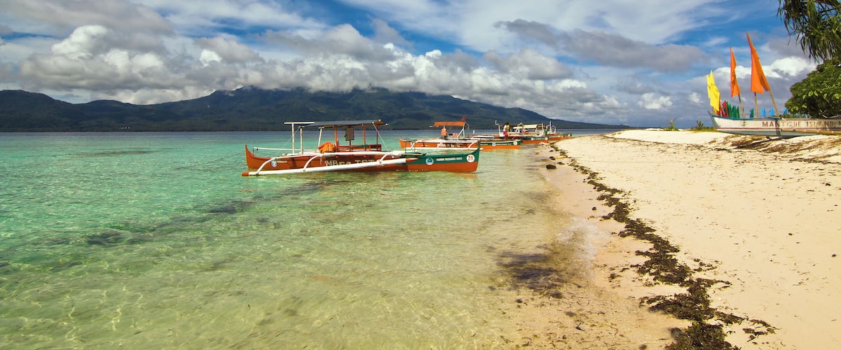 A quick travel by boat from the volcanic island of Camiguin, Mantigue is known not only for its white sandy beaches but is also popular among divers for its rich marine biodiversity. #asia #philippines #camiguin #mantigueisland #island #sea #beach #travel #sky #clouds #nature