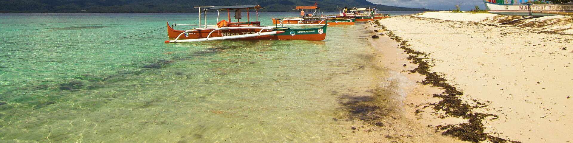 A quick travel by boat from the volcanic island of Camiguin, Mantigue is known not only for its white sandy beaches but is also popular among divers for its rich marine biodiversity. #asia #philippines #camiguin #mantigueisland #island #sea #beach #travel #sky #clouds #nature