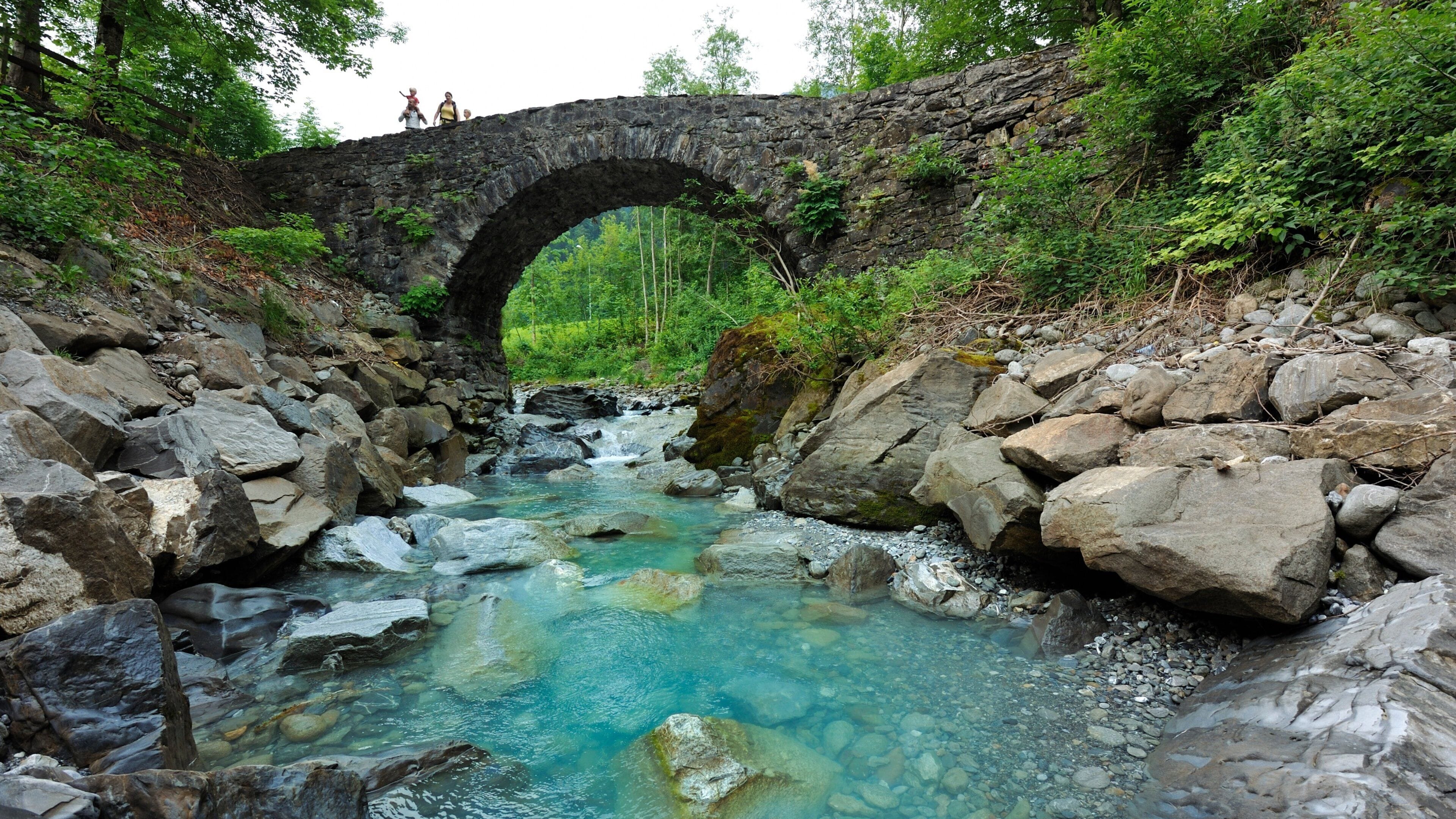 Engelberg-Titlis Ski Resort featuring a river or creek and a bridge