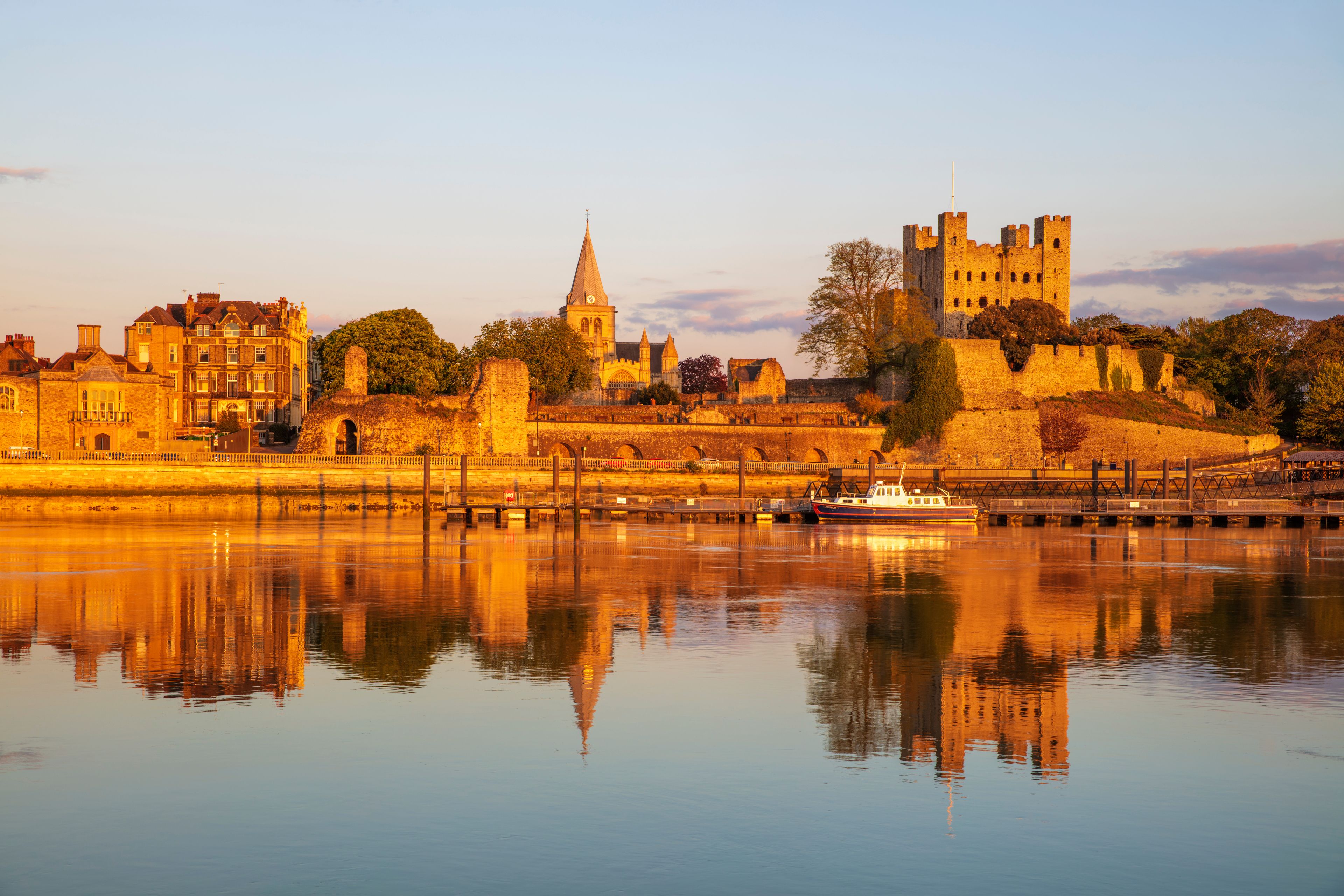 View across the River Medway to Rochester Castle and Cathedral at sunset, Rochester, Kent, England