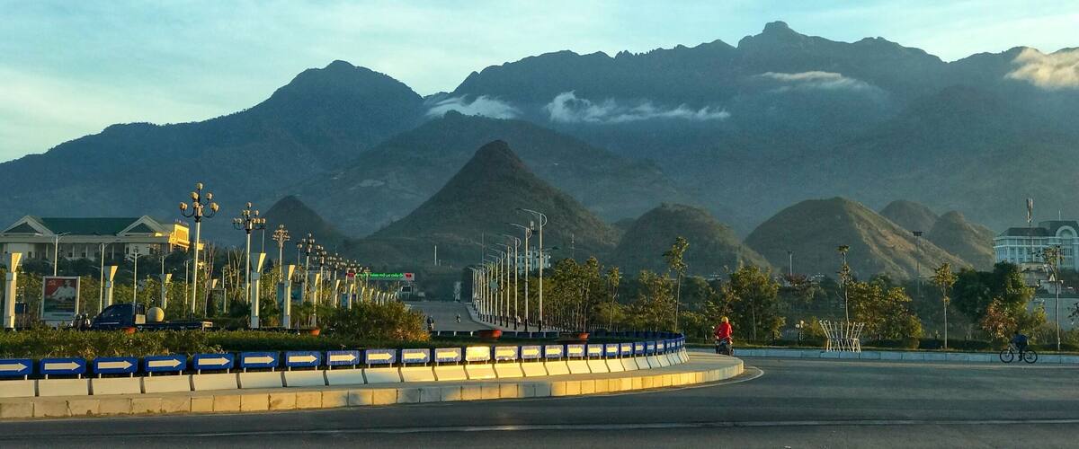 A roundabout with a mountain range in the background.