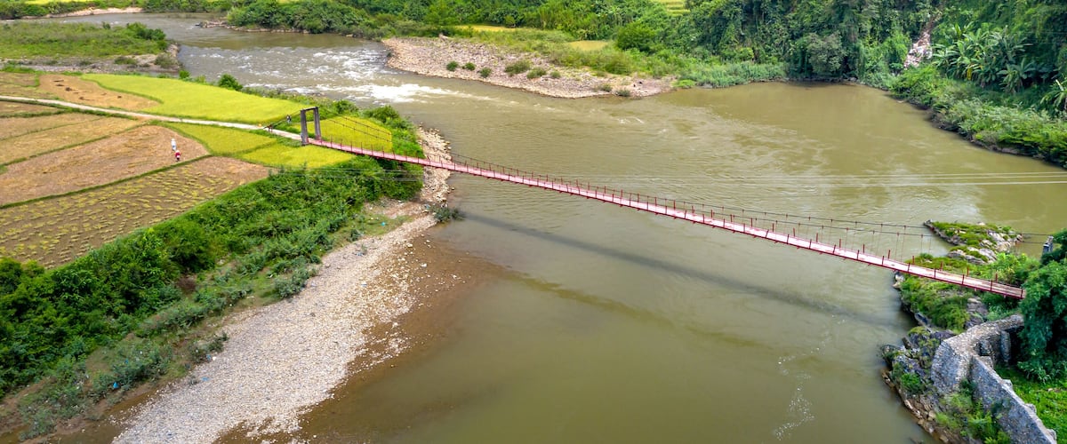 A suspension bridge over a stream in Lai Chau province in the northwest mountainous region of Vietnam