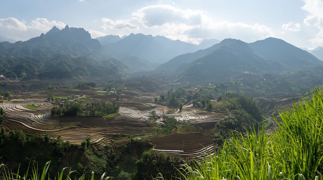 The pouring water season makes the terraced fields of Y Ty commune, Lao Cai province, Vietnam appear with brown soil blending with the beautiful sky.