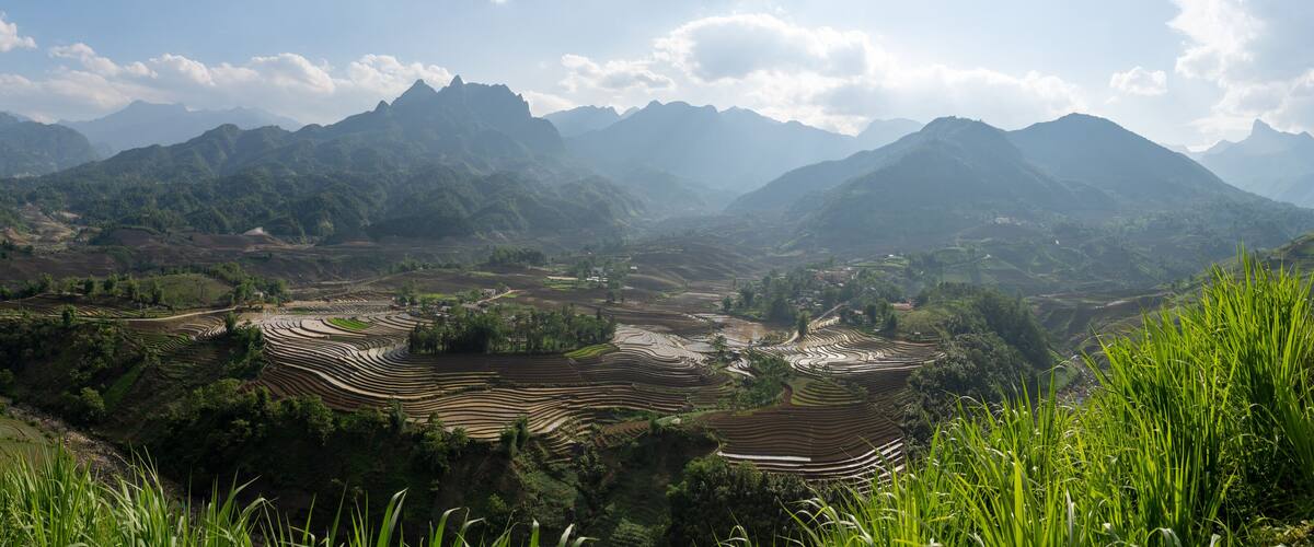 The pouring water season makes the terraced fields of Y Ty commune, Lao Cai province, Vietnam appear with brown soil blending with the beautiful sky.