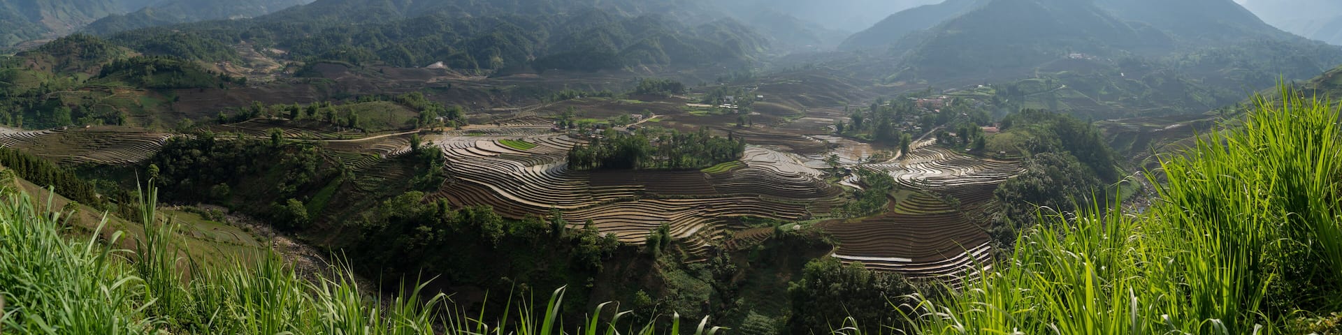 The pouring water season makes the terraced fields of Y Ty commune, Lao Cai province, Vietnam appear with brown soil blending with the beautiful sky.