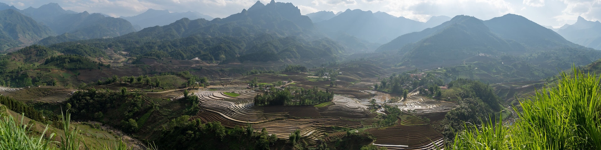 The pouring water season makes the terraced fields of Y Ty commune, Lao Cai province, Vietnam appear with brown soil blending with the beautiful sky.