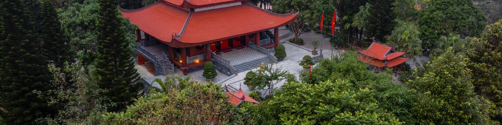 Aerial or distant panoramic views of the Dinh Hoa Safe Zone (ATK), a historic revolutionary base nestled in the mountainous region.