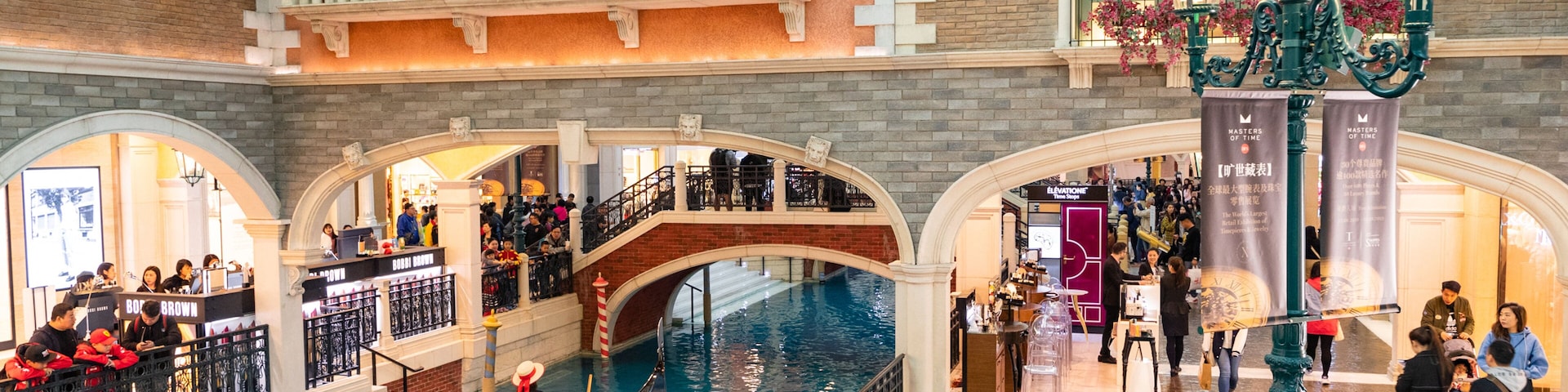 Venetian Macao Casino showing interior views, boating and a river or creek