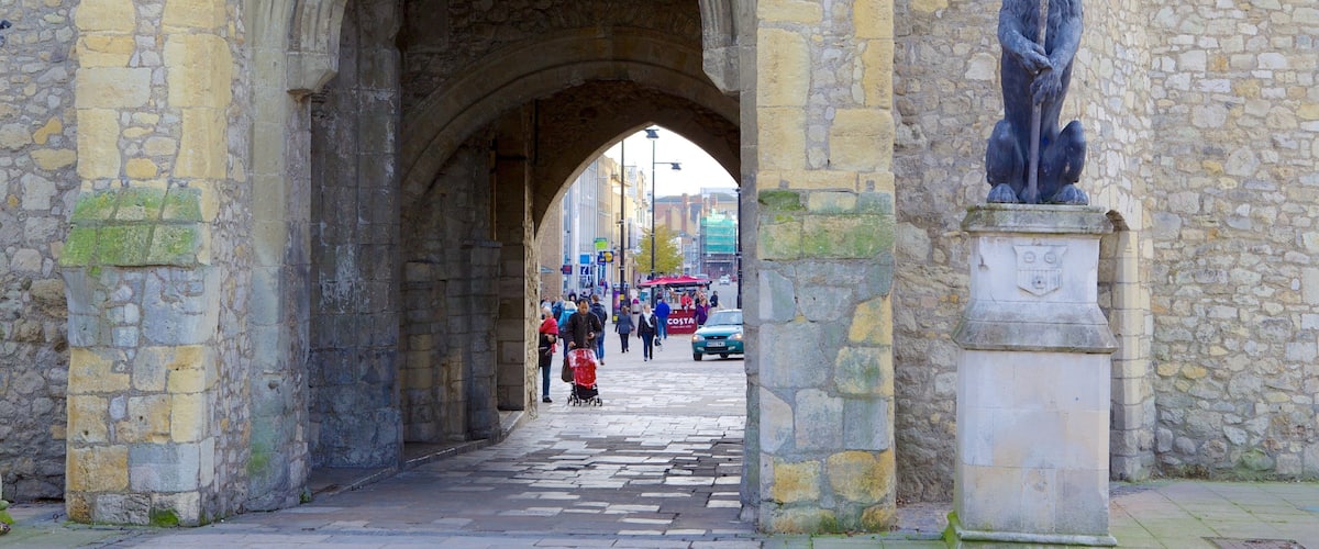 Old City Walls which includes a statue or sculpture and heritage architecture