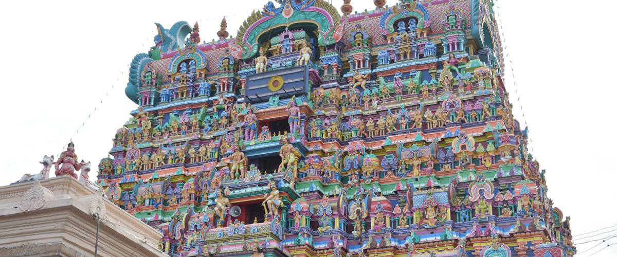 A colorful temple with intricate carvings and statues.