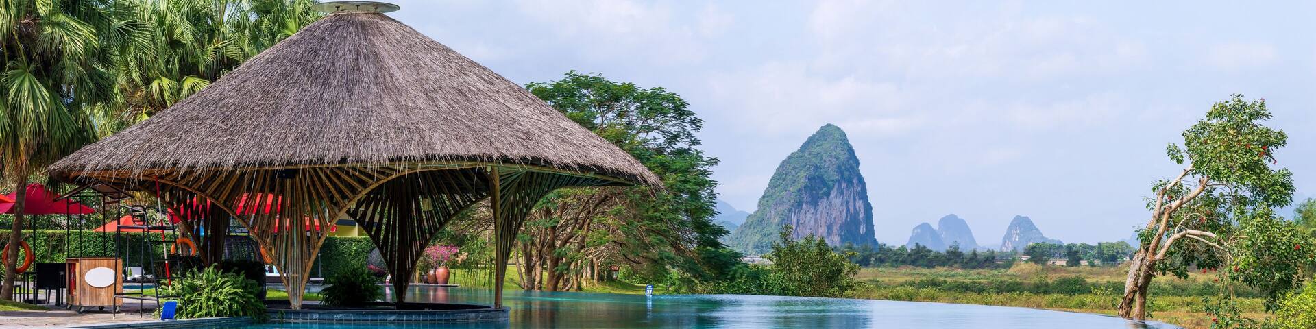 Infinity pool and peaceful panoramic natural view bring to relaxation moment in Hoa Binh province, Vietnam
