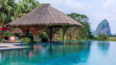 Infinity pool and peaceful panoramic natural view bring to relaxation moment in Hoa Binh province, Vietnam