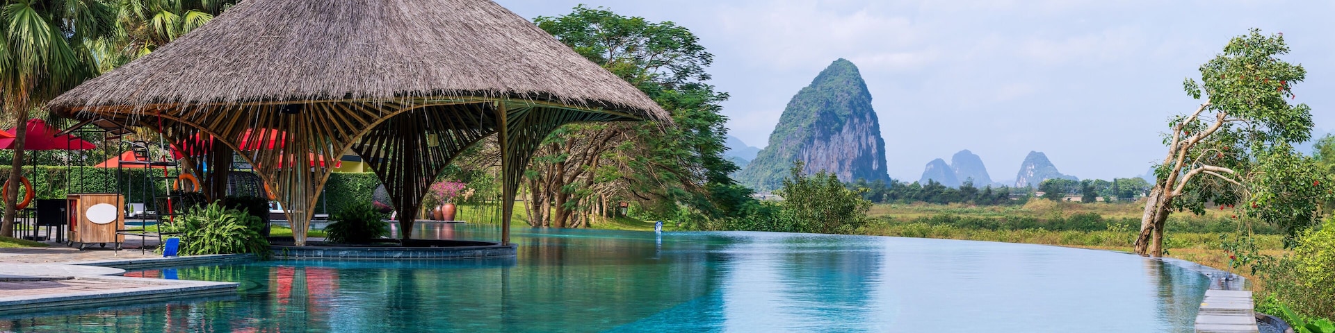 Infinity pool and peaceful panoramic natural view bring to relaxation moment in Hoa Binh province, Vietnam