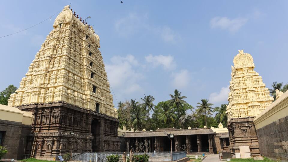 A temple with intricate carvings and a smaller shrine.