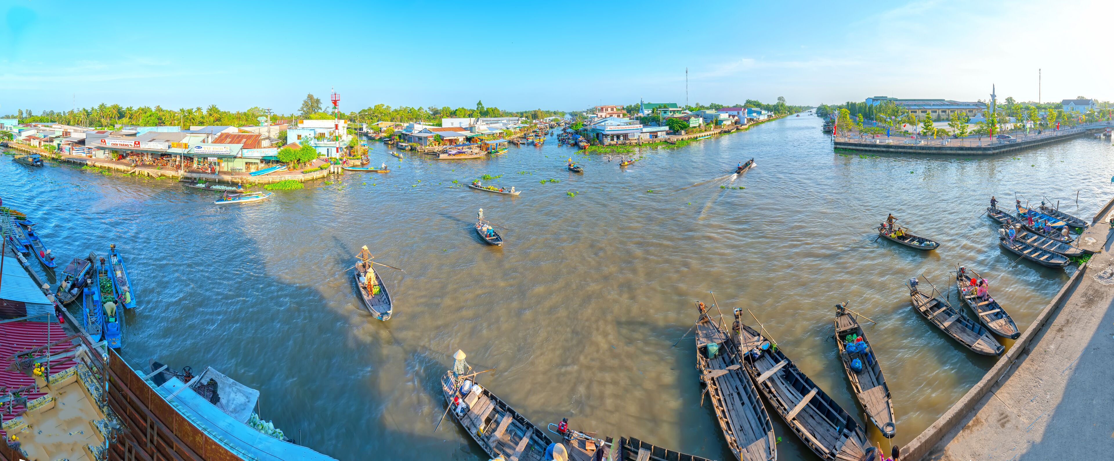 Ferry rowing takes visitors or agricultural products across river floating market , this is main transportation Lunar New Year in Soc Trang, Vietnam
