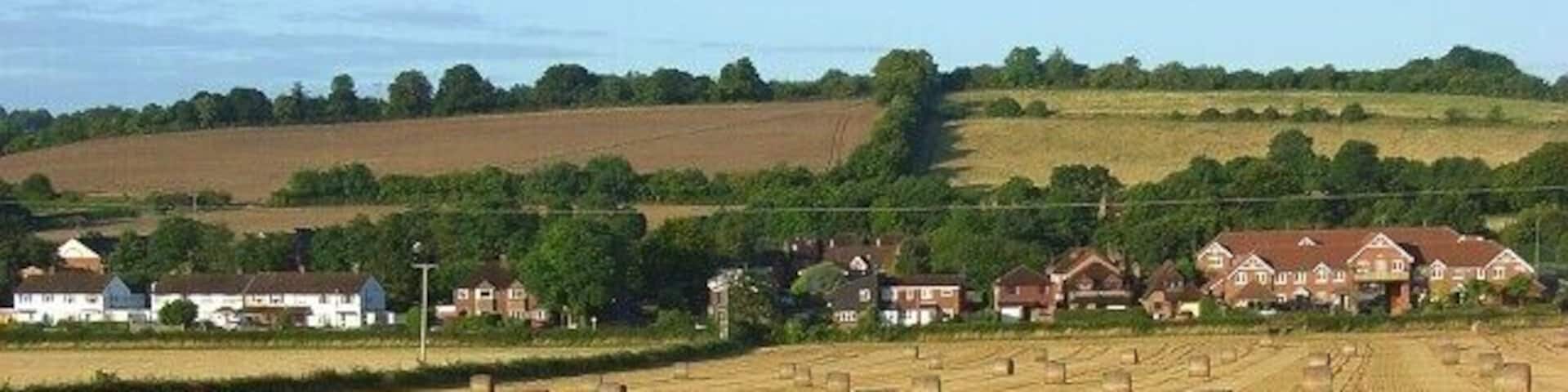Farmland, Saunderton Looking down to the houses and business premises around Saunderton Station.
