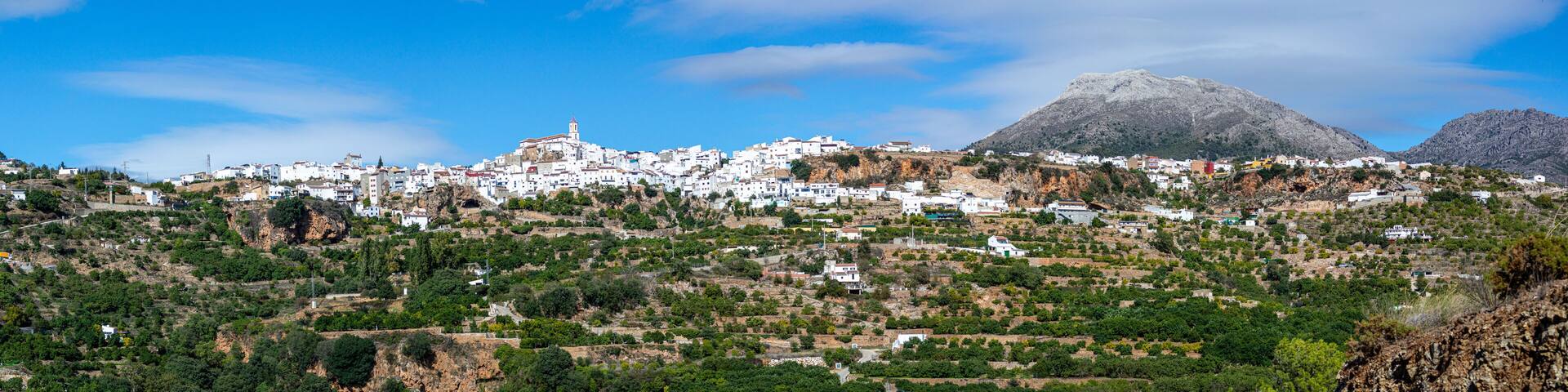 Panoramic view on picturesque typical Spanish village with cozy white houses in Yunquera, Andalusia, Spain
