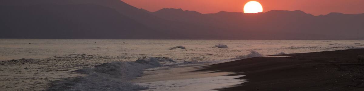 Sunset on the beach of Benajarafe. Malaga. Andalusia. Spain.