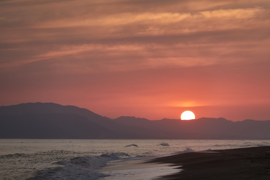 Sunset on the beach of Benajarafe. Malaga. Andalusia. Spain.