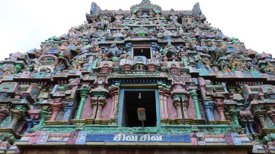 A temple with intricate carvings and multiple statues.