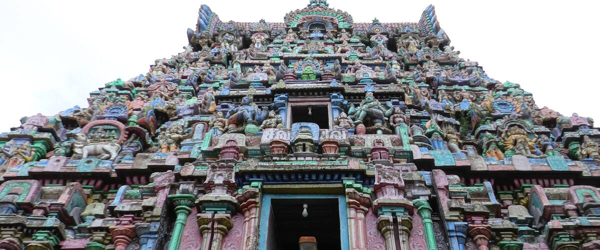 A temple with intricate carvings and multiple statues.