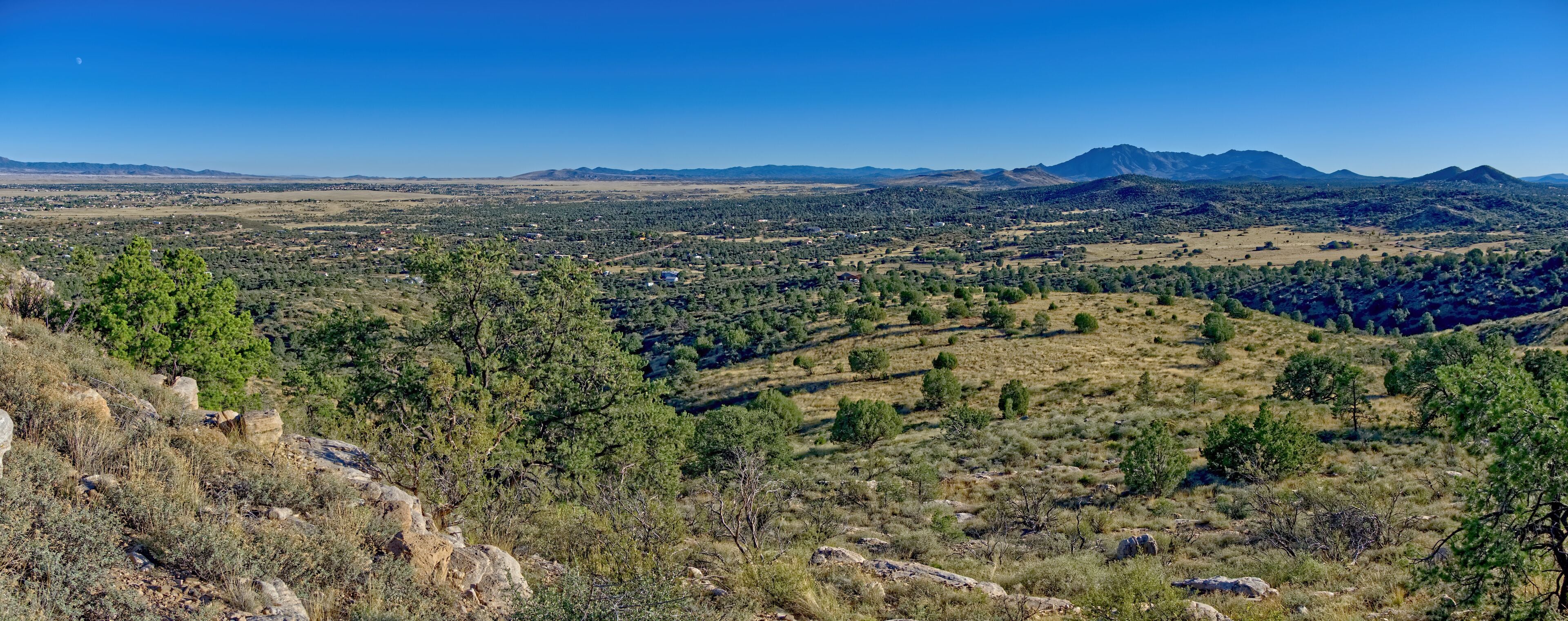 A panorama view of Chino Valley Arizona. This view is looking south toward Mount Union in the distance which is where Prescott is. This panorama is composed of 3 photos stitched together.