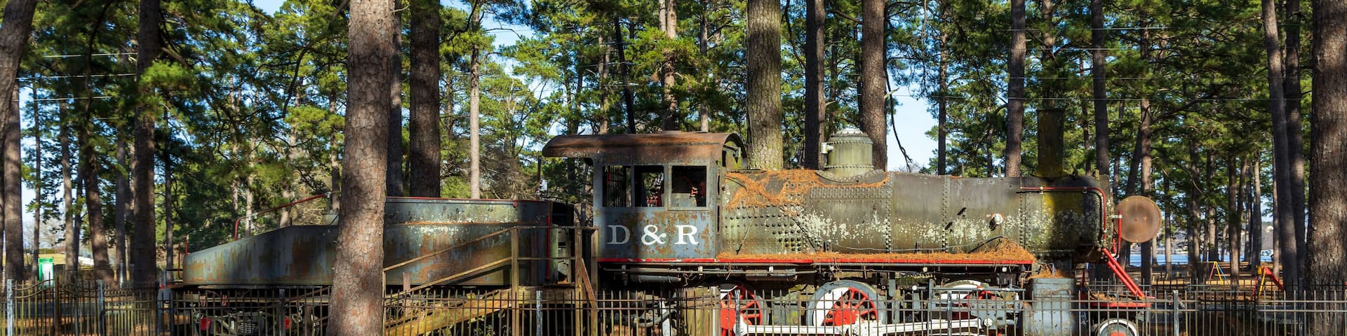 Beautiful Ford Park in Shreveport, Louisiana, with old historic locomotive on display