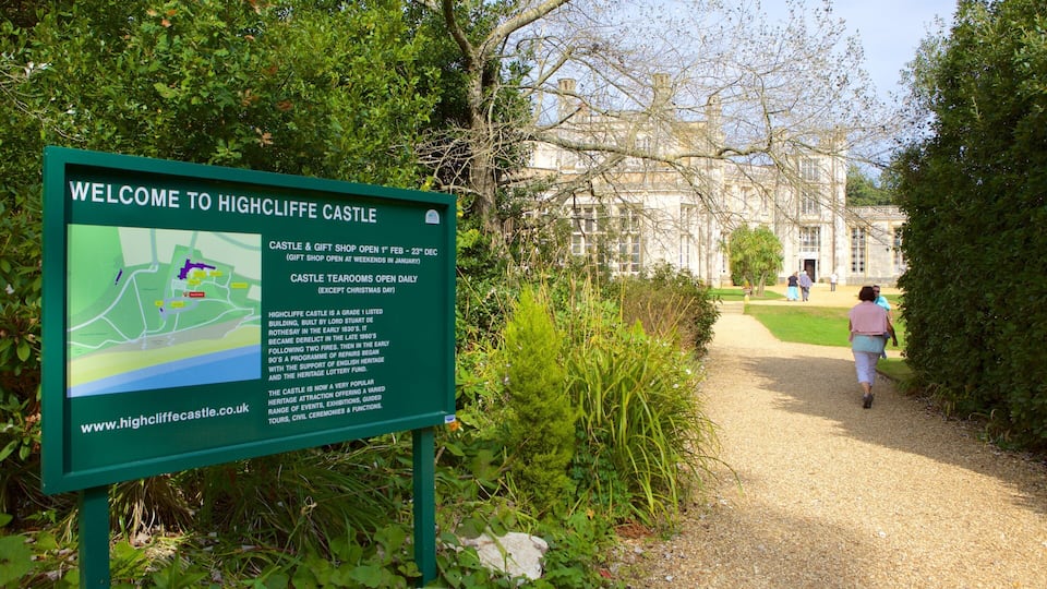 A sign welcoming visitors to Highcliffe Castle with a map and information about the castle and gift shop.