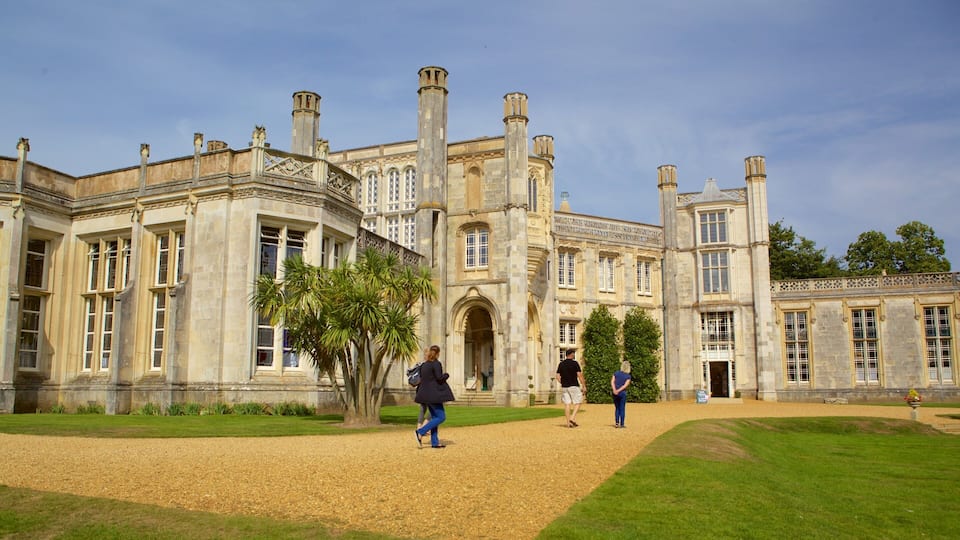 A historic building with large windows and a central archway.