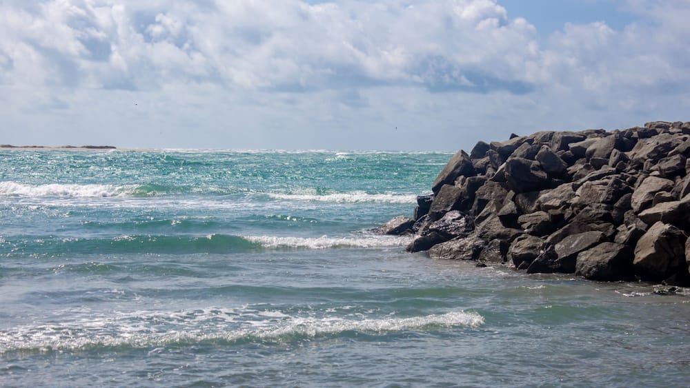 Arichal Munai (near Dhanushkodi) is the southern tip of Rameswaram Island in Tamil Nadu, India, It is a unique geographical point where the Bay of Bengal and the Indian Ocean converge