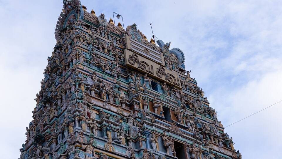 A detailed temple with intricate carvings and statues.